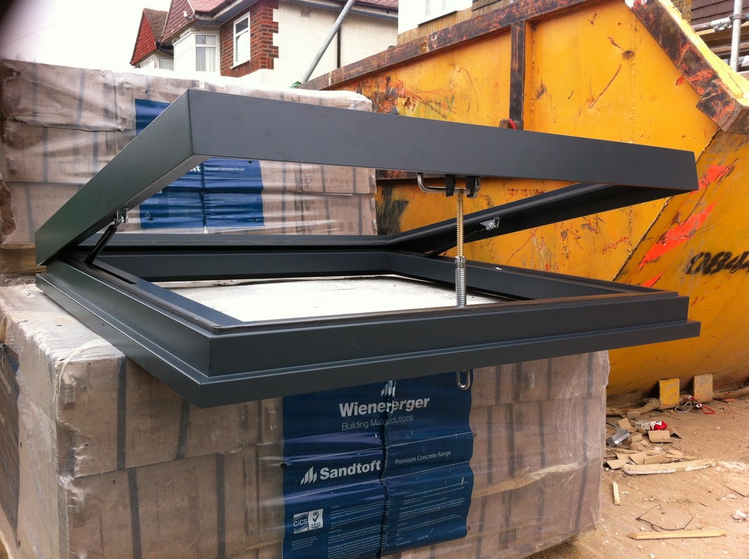 Opening flat roof skylight in anthracite grey installed in Maida Vale